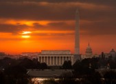 Fiery sunrise over monuments of Washington